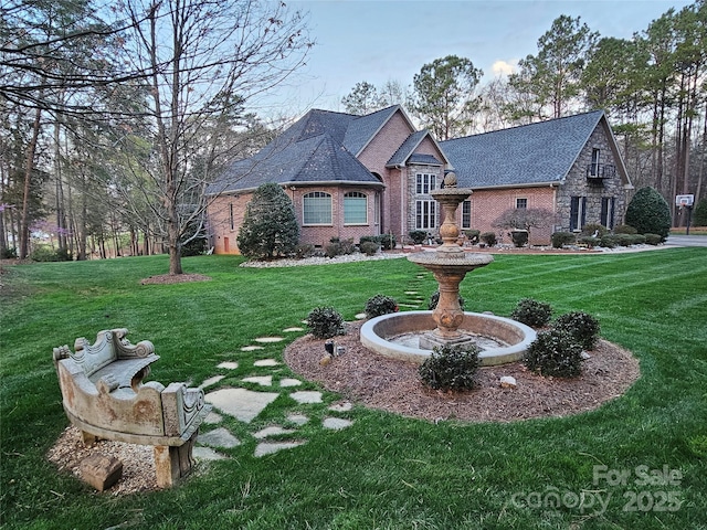1832 Marthas Vineyard Rd, York, SC 29745 - view of front of house featuring roof with shingles, a front lawn, and brick siding