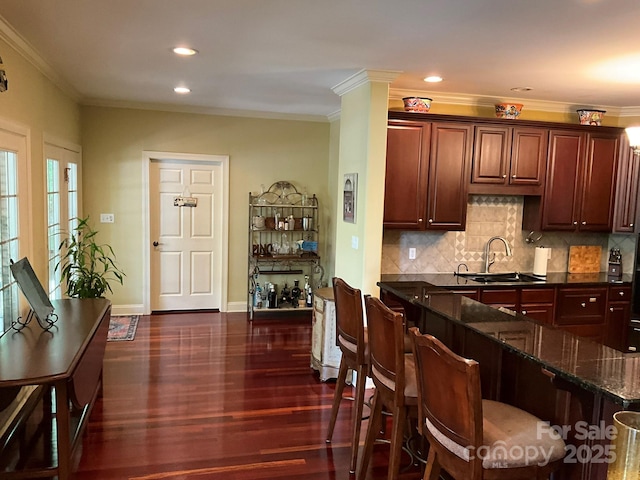 1832 Marthas Vineyard Rd, York, SC 29745 - kitchen with ornamental molding, a sink, tasteful backsplash, and dark wood-type flooring