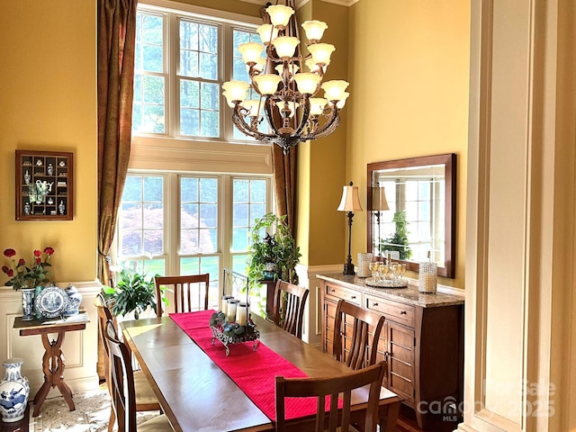 1832 Marthas Vineyard Rd, York, SC 29745 - dining area featuring a high ceiling, a chandelier, wainscoting, and a decorative wall