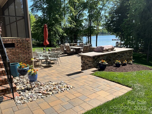 1832 Marthas Vineyard Rd, York, SC 29745 - view of patio with outdoor dining area and a water view