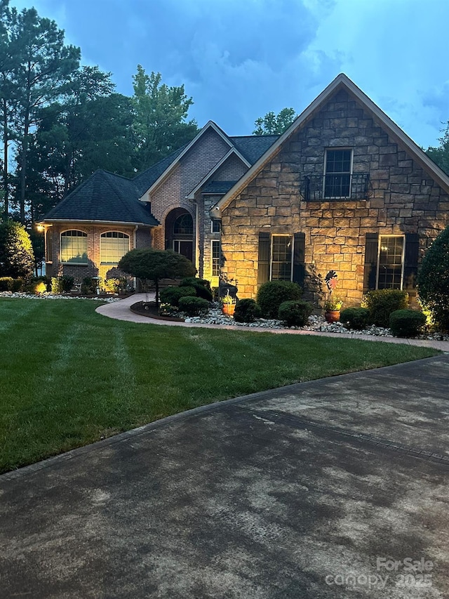 1832 Marthas Vineyard Rd, York, SC 29745 - view of front of property featuring an attached garage, a front lawn, and stone siding