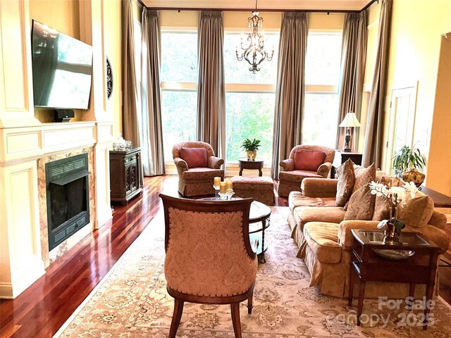1832 Marthas Vineyard Rd, York, SC 29745 - living area with an inviting chandelier, a high end fireplace, and dark wood-type flooring