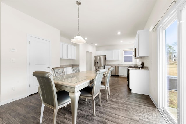 dining area with dark wood-type flooring, baseboards, and recessed lighting