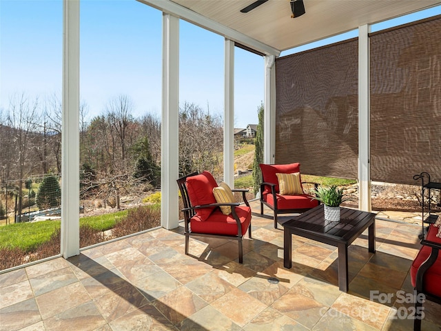 sunroom / solarium with an outdoor hangout area and ceiling fan