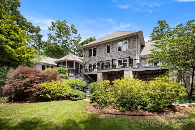 421 N Boundary Rd, Mill Spring, NC 28756 - back of house featuring stairway, a yard, a sunroom, and a wooden deck