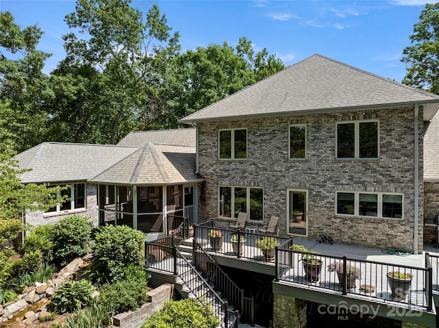 421 N Boundary Rd, Mill Spring, NC 28756 - back of property with a sunroom, roof with shingles, a deck, and brick siding