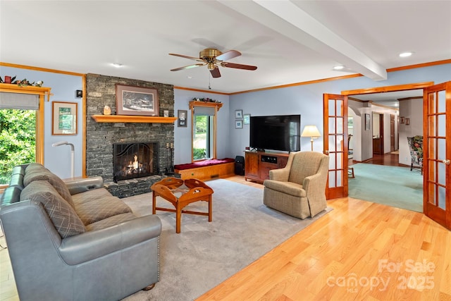 421 N Boundary Rd, Mill Spring, NC 28756 - living area featuring wood finished floors, a stone fireplace, a ceiling fan, crown molding, and recessed lighting