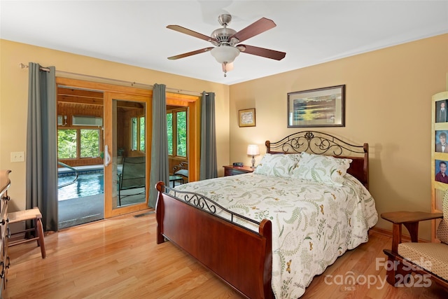 421 N Boundary Rd, Mill Spring, NC 28756 - bedroom featuring access to exterior, light wood-type flooring, and ceiling fan
