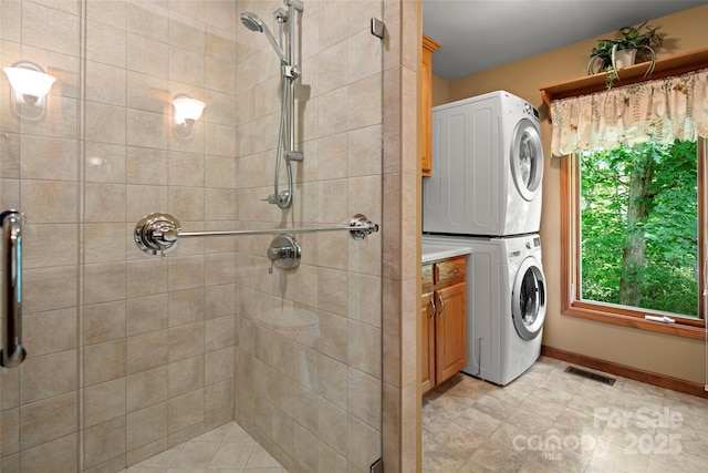 421 N Boundary Rd, Mill Spring, NC 28756 - full bath featuring stacked washing machine and dryer, a shower stall, and baseboards