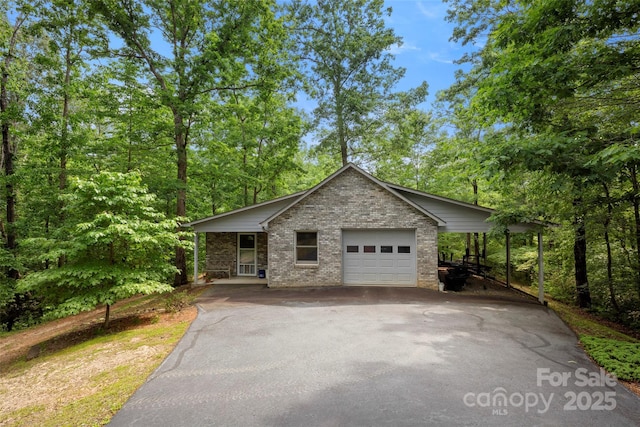 421 N Boundary Rd, Mill Spring, NC 28756 - view of front of house with brick siding and asphalt driveway