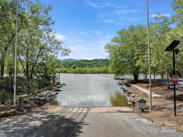 421 N Boundary Rd, Mill Spring, NC 28756 - water view featuring a boat ramp, a heavily wooded area, and a dock