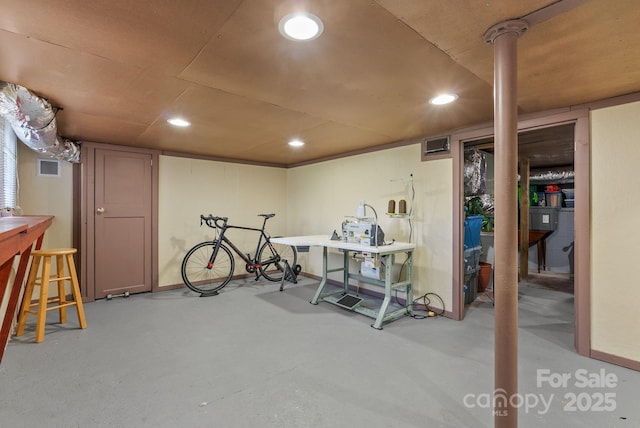 finished basement with visible vents and recessed lighting