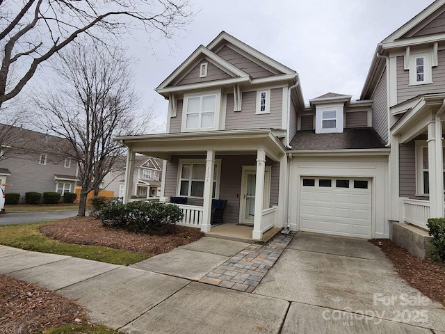18224 Taffrail Way, Cornelius, NC 28031 - view of front of home with covered porch, a garage, and concrete driveway