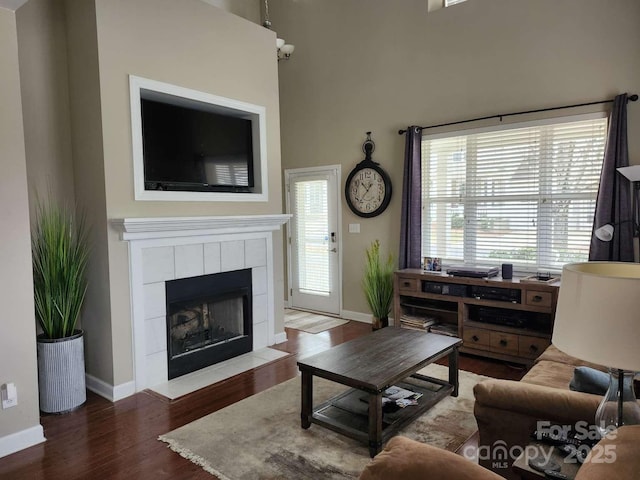 18224 Taffrail Way, Cornelius, NC 28031 - living room with baseboards, a fireplace, and wood finished floors