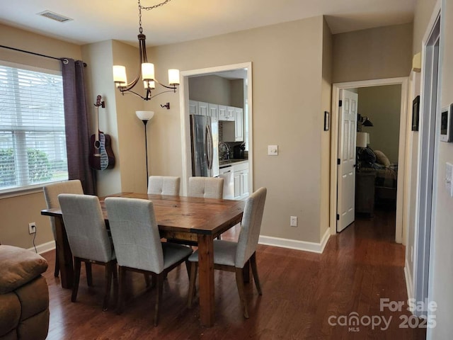 18224 Taffrail Way, Cornelius, NC 28031 - dining area featuring baseboards, visible vents, a notable chandelier, and dark wood finished floors