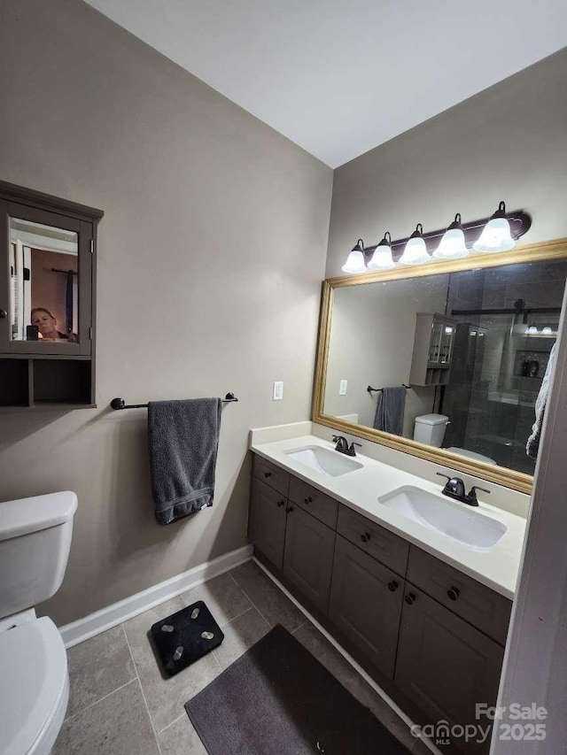 18224 Taffrail Way, Cornelius, NC 28031 - full bathroom featuring a stall shower, double vanity, toilet, and a sink