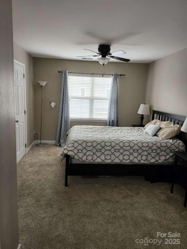 18224 Taffrail Way, Cornelius, NC 28031 - bedroom with baseboards, ceiling fan, and light carpet