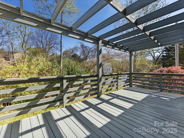 wooden deck featuring a pergola