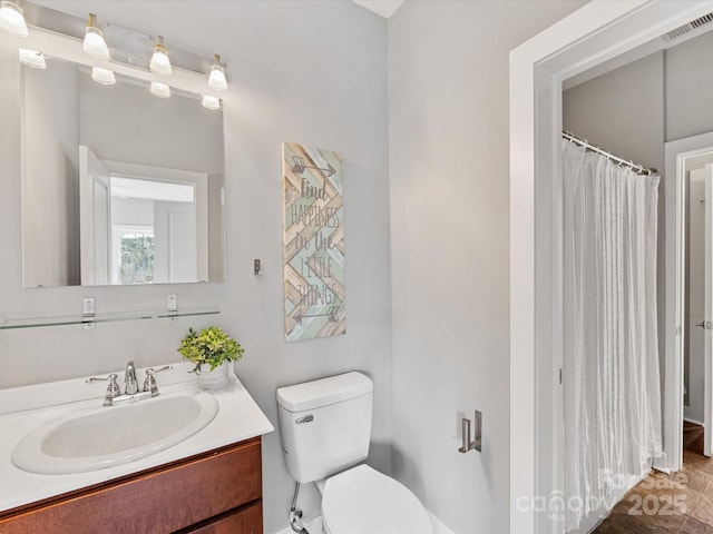 bathroom featuring toilet, visible vents, curtained shower, and vanity