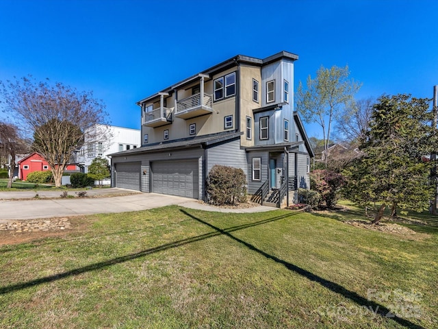 view of front of property with an attached garage, a front yard, driveway, and a balcony