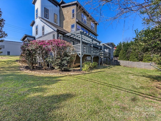 exterior space featuring a yard, fence, a pergola, and a deck