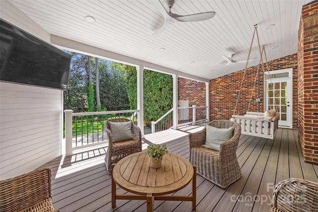 wooden terrace with a ceiling fan
