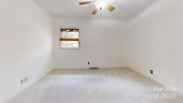 116 Jonas Dr, Lincolnton, NC 28092 - spare room with carpet flooring, crown molding, ceiling fan, and visible vents