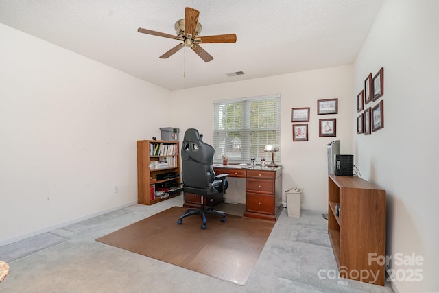 office area with light colored carpet and a ceiling fan