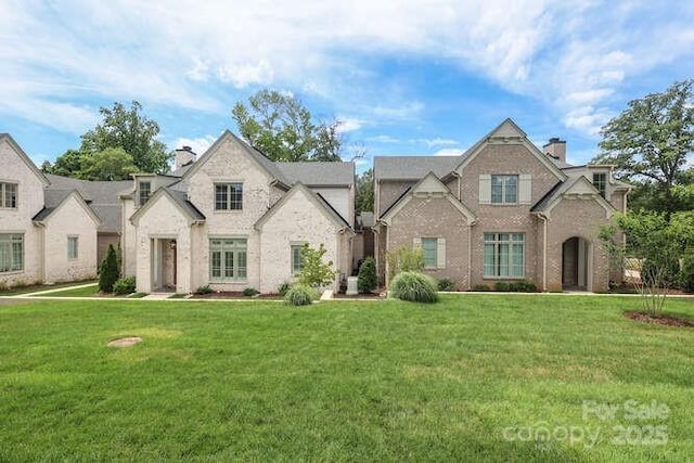 3119 Knowlton Ln, Charlotte, NC 28205 - view of front facade with a chimney, a front lawn, and brick siding