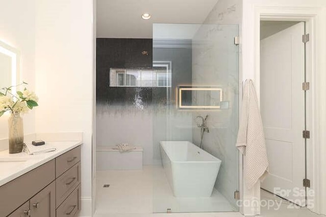 3119 Knowlton Ln, Charlotte, NC 28205 - bathroom with a soaking tub, vanity, and recessed lighting