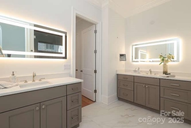 3119 Knowlton Ln, Charlotte, NC 28205 - full bathroom featuring two vanities, marble finish floors, crown molding, and baseboards
