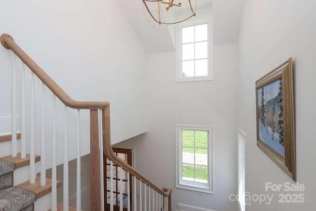 3119 Knowlton Ln, Charlotte, NC 28205 - staircase with high vaulted ceiling, plenty of natural light, and a chandelier