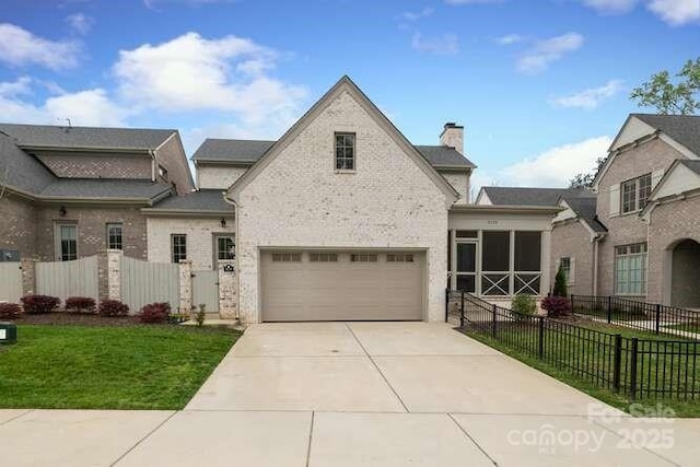 3119 Knowlton Ln, Charlotte, NC 28205 - french provincial home featuring an attached garage, a chimney, and driveway