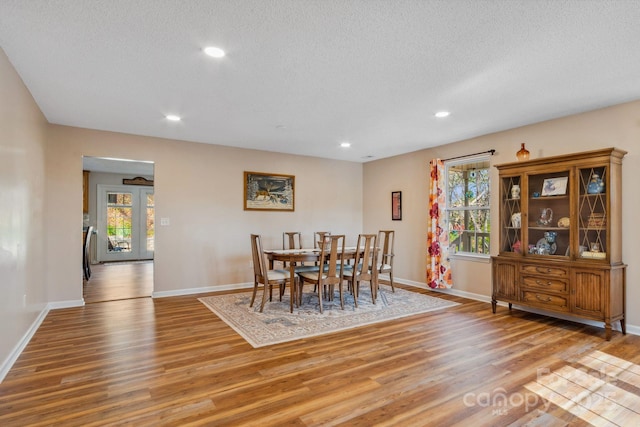 12 Hutchinson Woods Dr, Fletcher, NC 28732 - dining room with light wood finished floors, baseboards, recessed lighting, and a textured ceiling