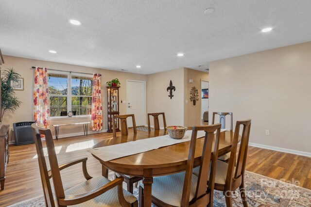 12 Hutchinson Woods Dr, Fletcher, NC 28732 - dining space with recessed lighting, light wood-style floors, a textured ceiling, and baseboards