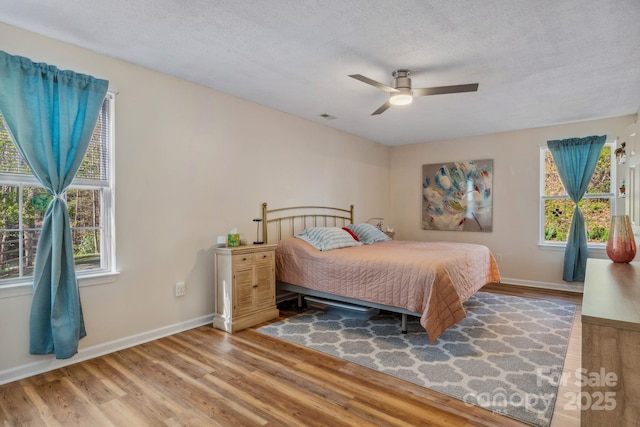 12 Hutchinson Woods Dr, Fletcher, NC 28732 - bedroom featuring visible vents, baseboards, a ceiling fan, and wood finished floors