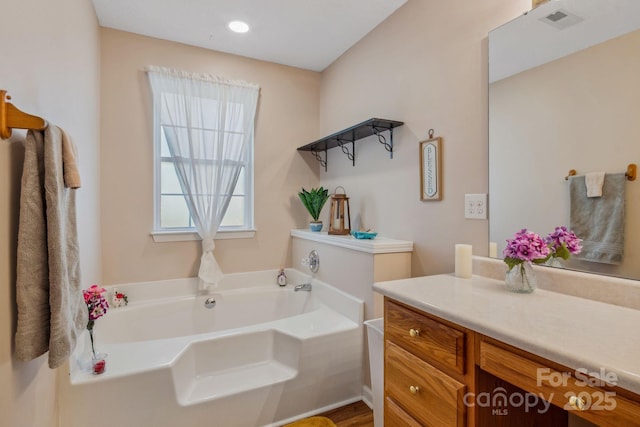 12 Hutchinson Woods Dr, Fletcher, NC 28732 - full bathroom featuring recessed lighting, visible vents, a garden tub, and vanity
