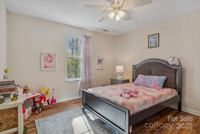 12 Hutchinson Woods Dr, Fletcher, NC 28732 - bedroom featuring wood finished floors, visible vents, baseboards, and ceiling fan