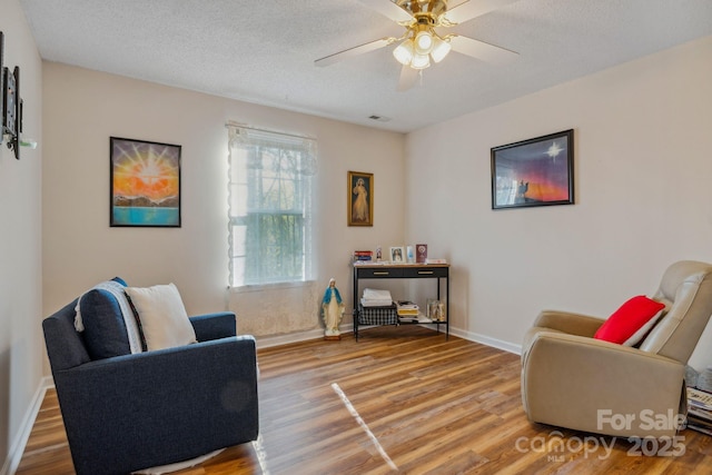 12 Hutchinson Woods Dr, Fletcher, NC 28732 - sitting room featuring wood finished floors, visible vents, a ceiling fan, baseboards, and a textured ceiling