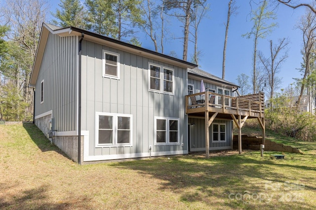 209 Fall Leaves Dr, Fairview, NC 28730 - rear view of house with a deck, a yard, and board and batten siding