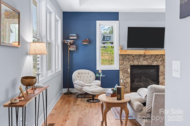 209 Fall Leaves Dr, Fairview, NC 28730 - sitting room featuring light wood-type flooring and a fireplace