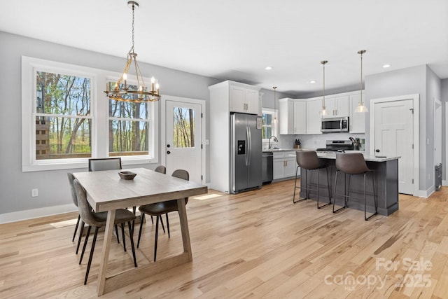 209 Fall Leaves Dr, Fairview, NC 28730 - dining space featuring a chandelier, plenty of natural light, light wood-type flooring, and recessed lighting