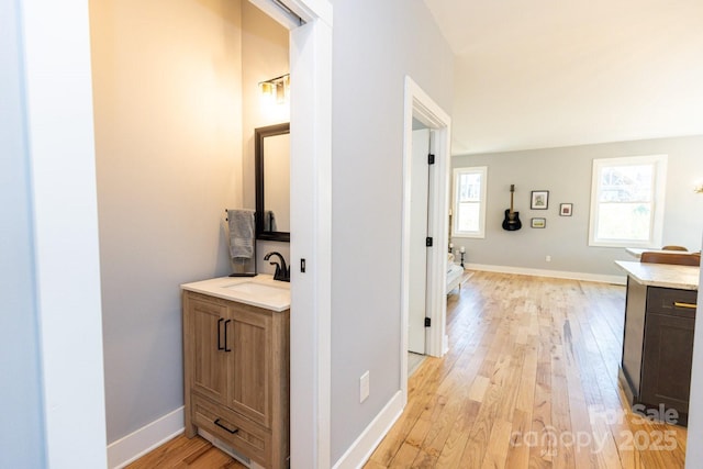 209 Fall Leaves Dr, Fairview, NC 28730 - hallway featuring a sink and light wood-style flooring