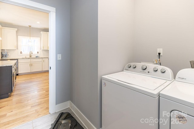 209 Fall Leaves Dr, Fairview, NC 28730 - laundry area featuring washing machine and dryer and light wood finished floors