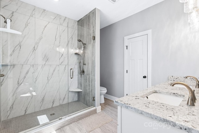 209 Fall Leaves Dr, Fairview, NC 28730 - full bathroom featuring vanity, a marble finish shower, and wood finished floors