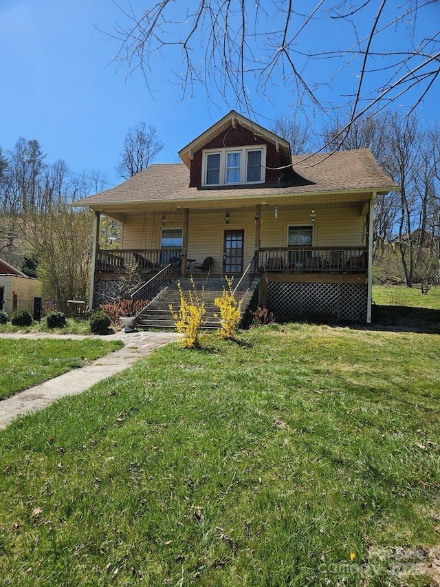 212 S Mitchell Ave, Bakersville, NC 28705 - view of front of house featuring a front lawn, a shingled roof, covered porch, and stairs