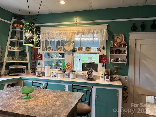 212 S Mitchell Ave, Bakersville, NC 28705 - kitchen featuring a toaster and a kitchen island