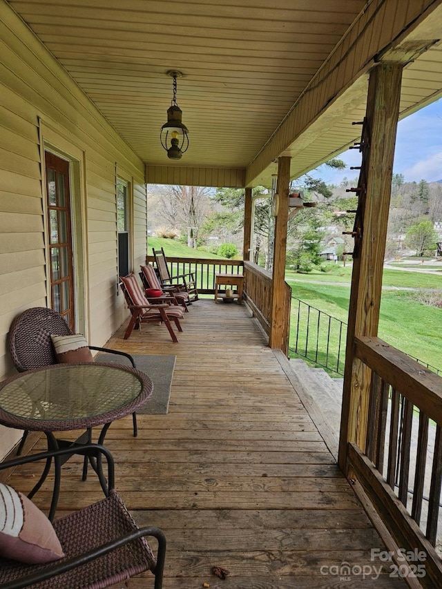 212 S Mitchell Ave, Bakersville, NC 28705 - wooden deck with covered porch