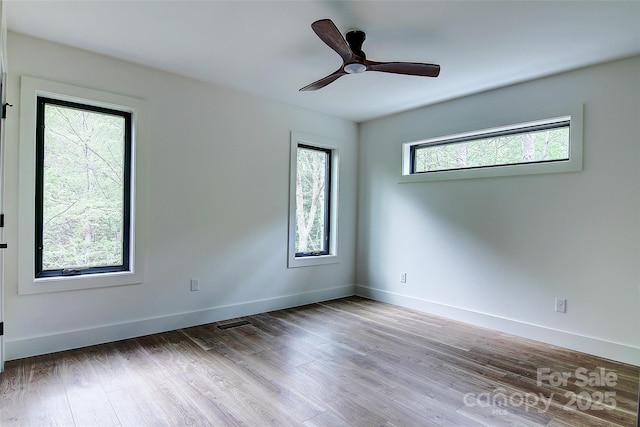 181 Curly Maple Dr, Canton, NC 28716 - empty room featuring a ceiling fan, baseboards, visible vents, and wood finished floors