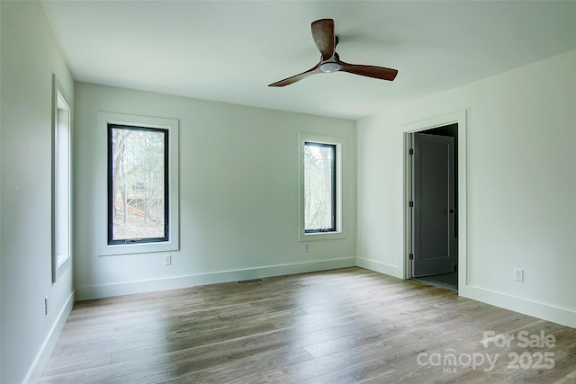 181 Curly Maple Dr, Canton, NC 28716 - unfurnished bedroom with baseboards, a ceiling fan, wood finished floors, and visible vents